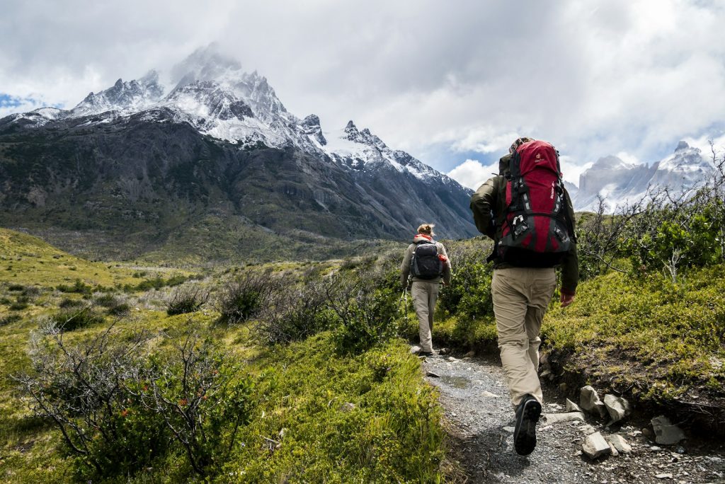 Hikers trekking East African mountain trail